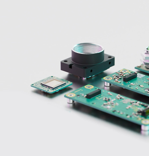 Components of a uEye ACP industrial camera arranged next to each other